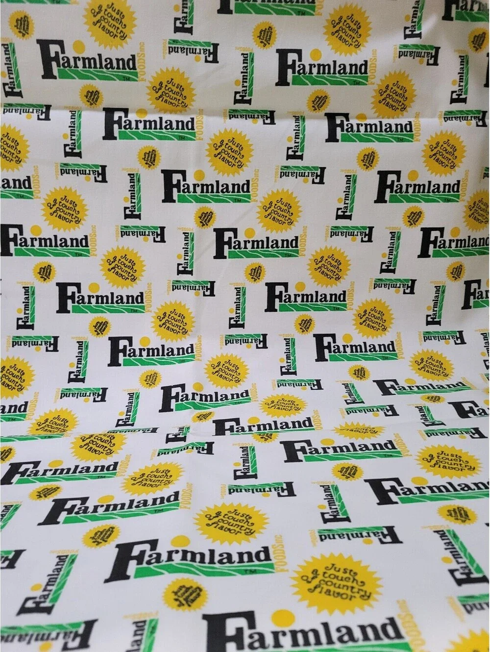 Farmland Cotton Fabric with Yellow and Green Logo Print 1 yard